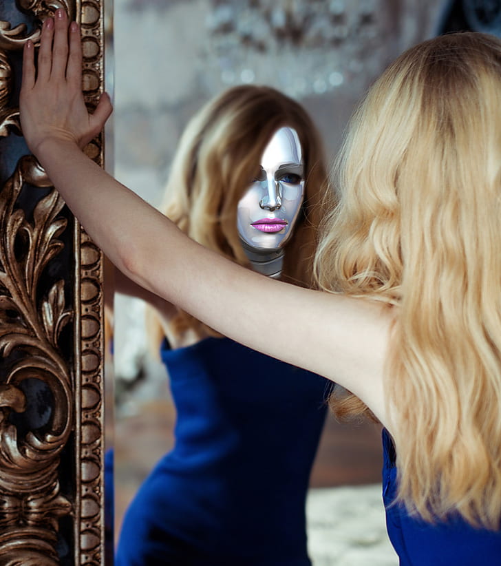woman wearing blue dress leaning on mirror