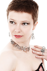 woman wearing silver-colored choker and chandelier earrings