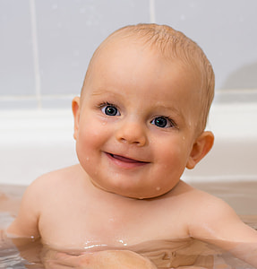 topless baby in water