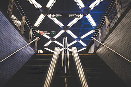 low light photography of stairs of subway station