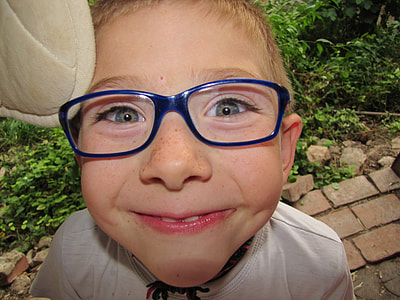 toddler in eyeglasses with blue frames