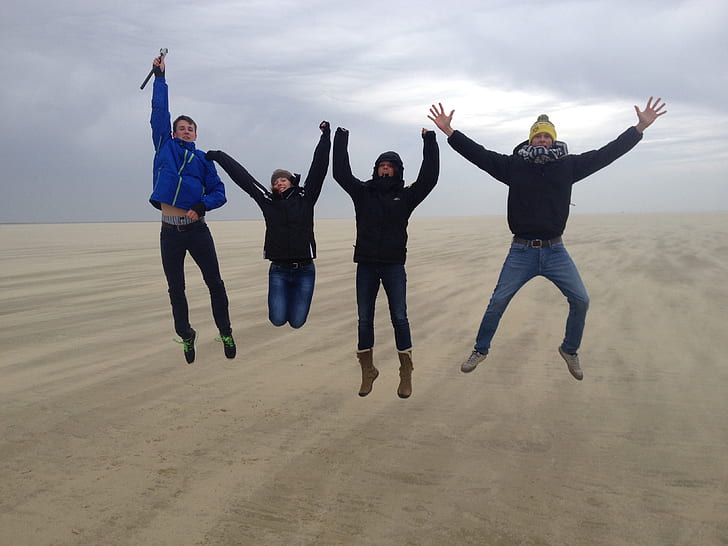 five men jumped on desert