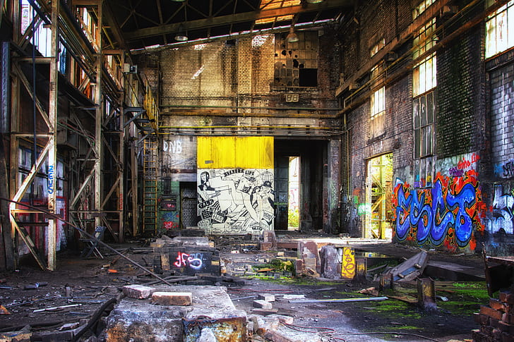 empty warehouse filled with graffiti