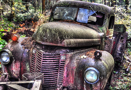 abandoned classic red and green vehicle