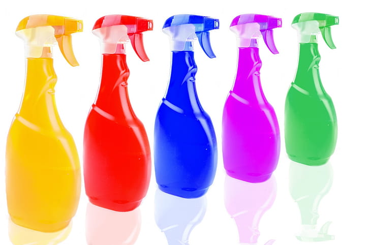 five assorted-color spray bottles