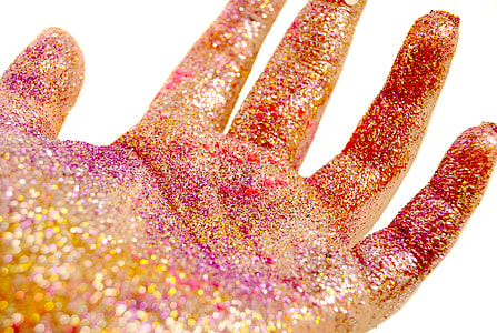 glitters on human left palm