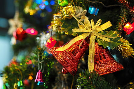 close-up photography of Christmas three bell ornament