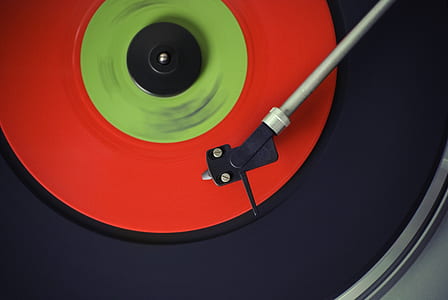macro photography of black and red vinyl record
