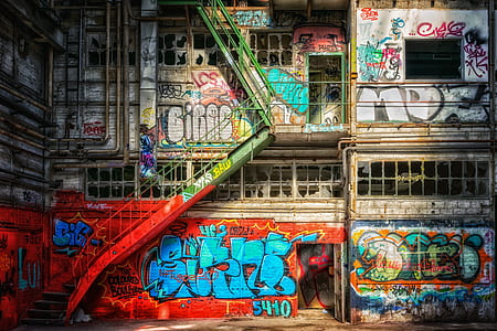 multicolored graffiti painting building
