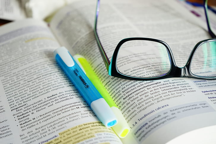 eyeglasses on book page