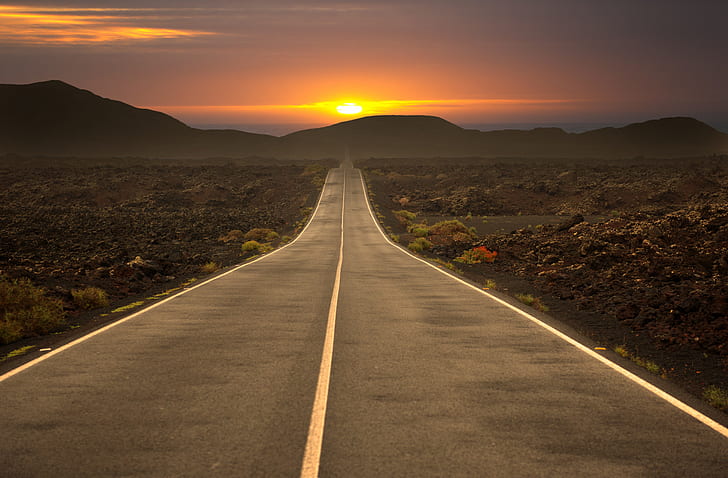 asphalt road during sunset