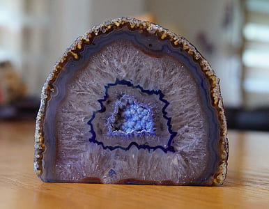 blue geode on brown wooden table