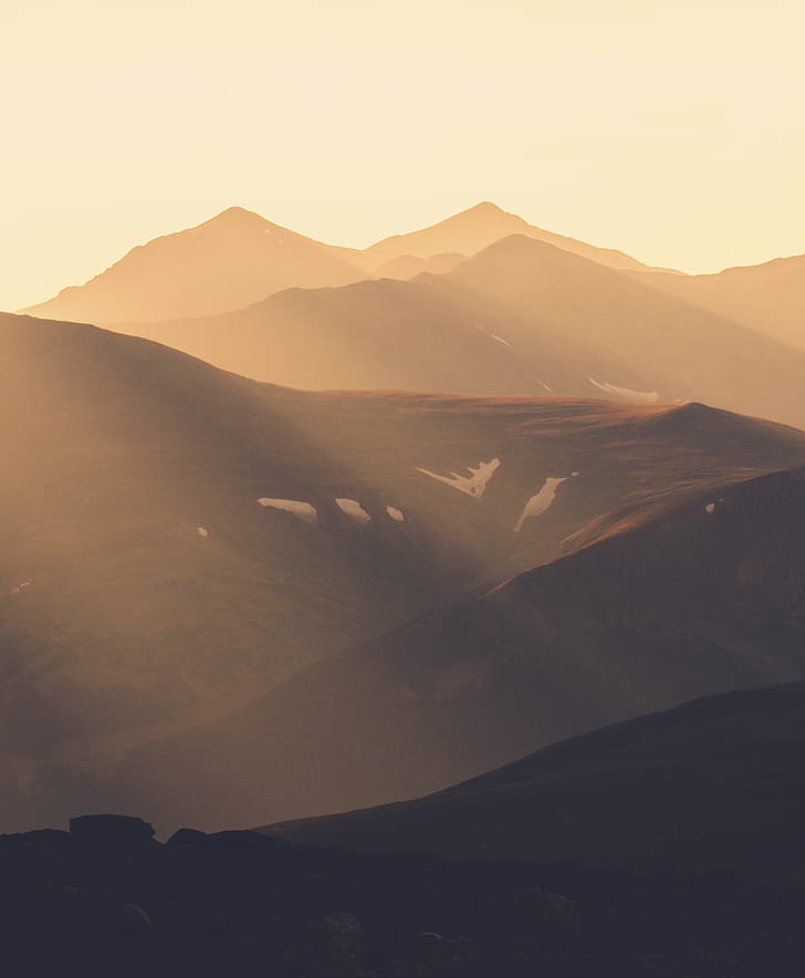 brown mountains under golden hour