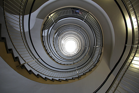 high-angle photography of spiral stairs
