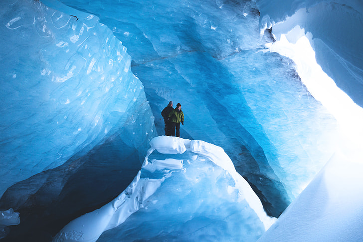 Two people exploring the snow and ice in Canada
