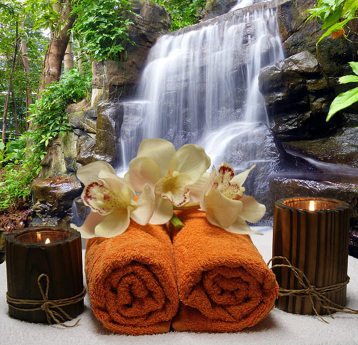 two brown towels with candles