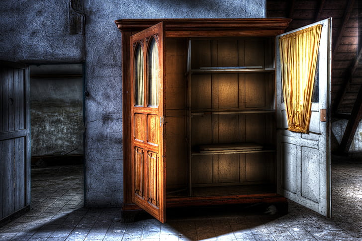 photograph of opened cabinet between doorway