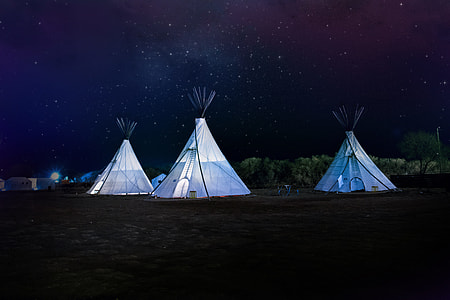three white tents during night time