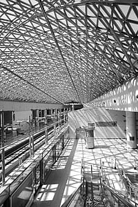 Grey Steel Frame Building Ceiling in Black and White Photograph during Daytime