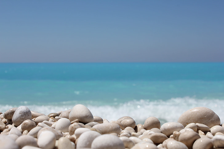white stones on sea shore during daytime