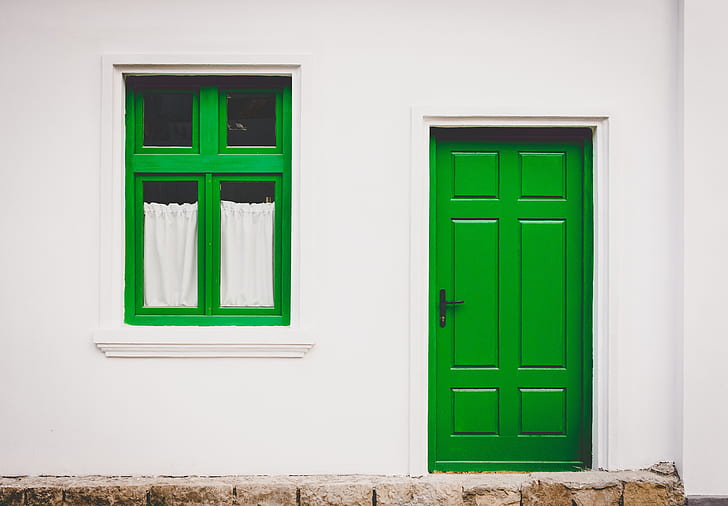 closed green wooden 6-panel door
