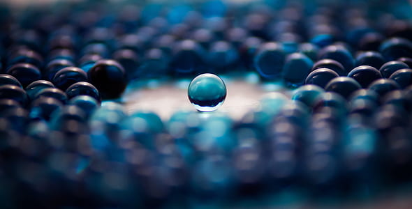 selective focus photography of blue marble ball
