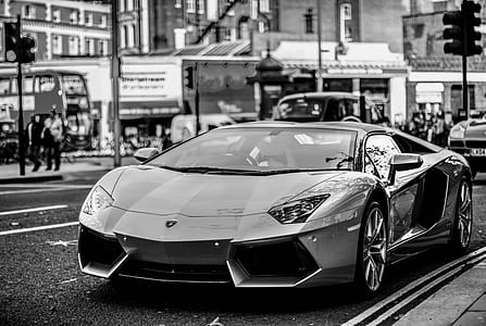 grayscale photography of super car on road