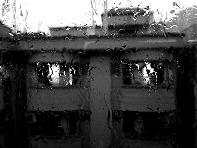 Rain Pouring on Glass Window