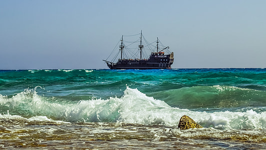 brown galleon ship during daytime
