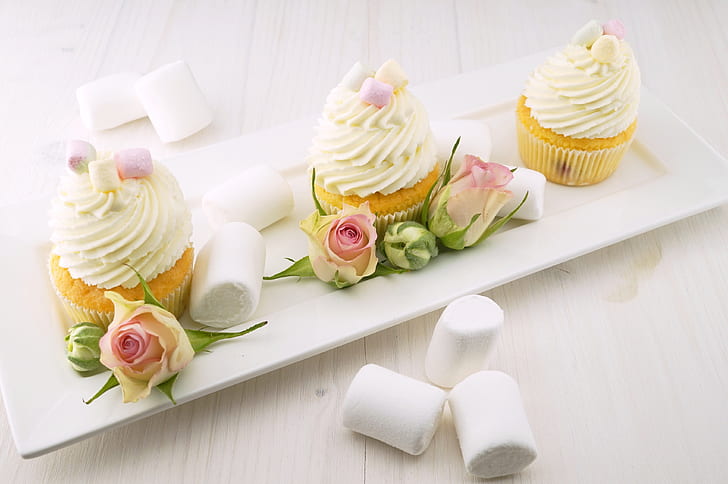 three cupcakes served on white ceramic plate