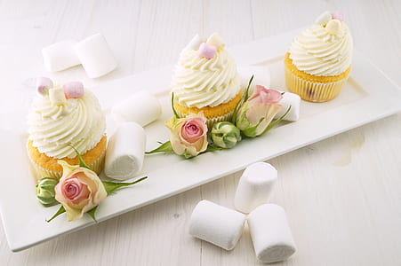 three cupcakes served on white ceramic plate