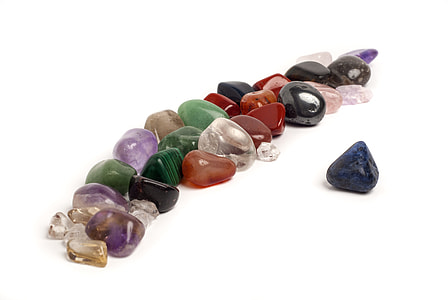 assorted-color stones on white background