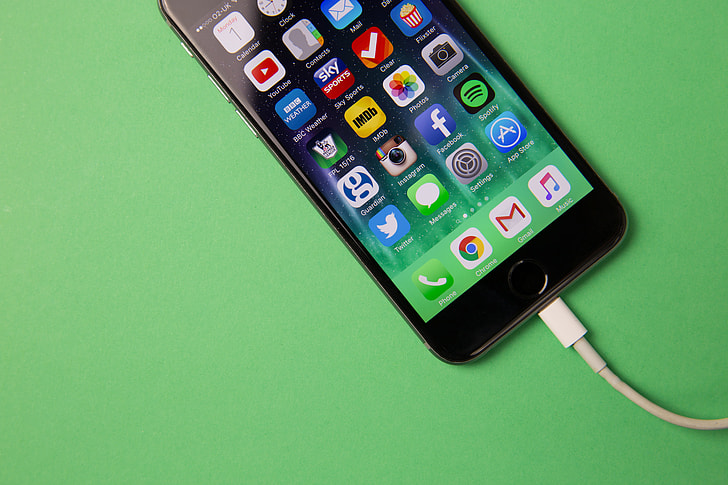 Royalty-Free photo: Apple iPhone mobile smartphone on charge - PickPik