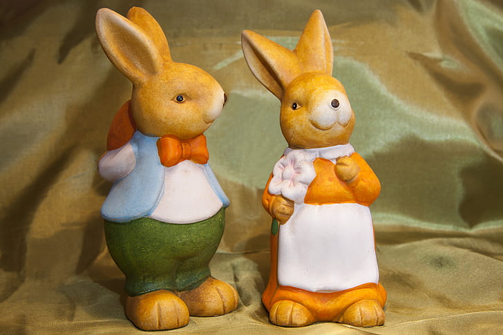 boy and white rabbit figurines