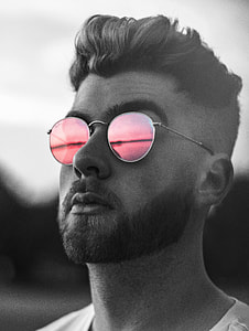 man wearing pink lens sunglasses