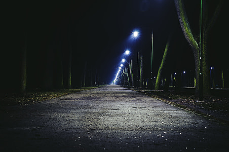 gray concrete pavement photo taken during night time