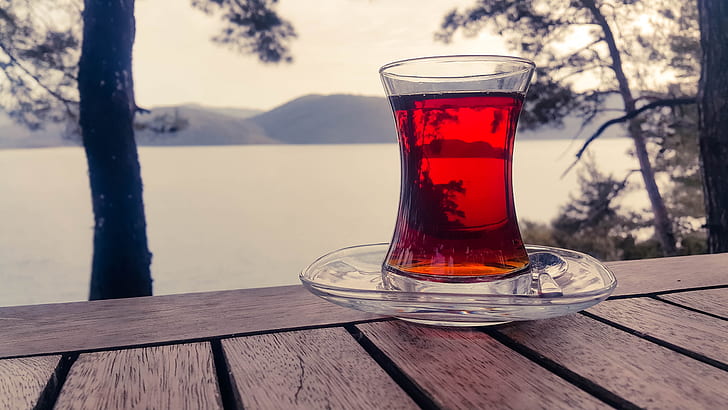 Turkish clear glass teacup on selective focus photograph