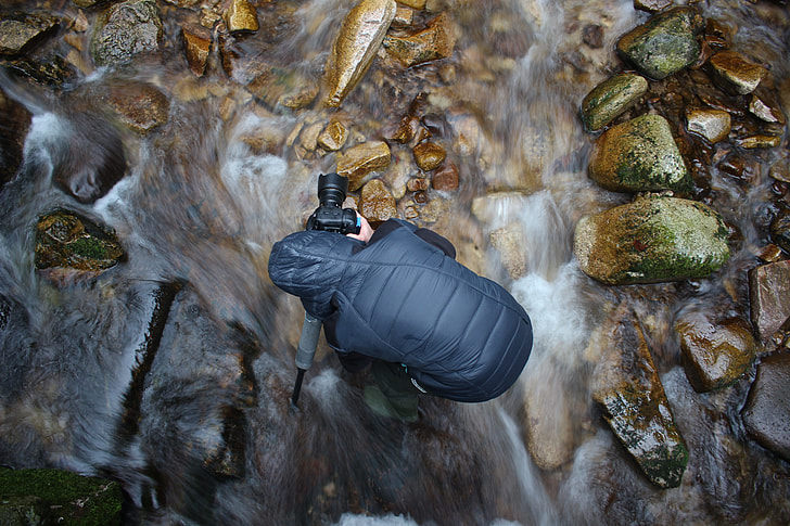 Camera man on water stream