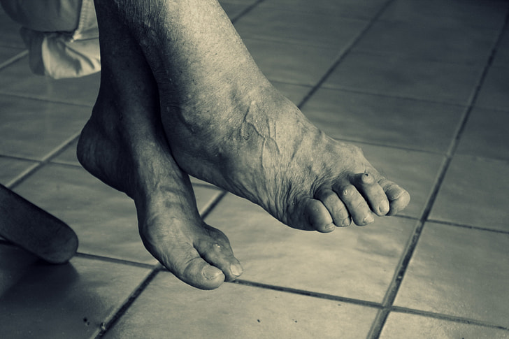 grayscale photography of feet