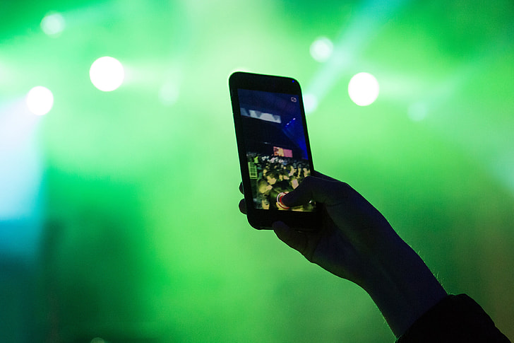Using mobile smartphone at music festival