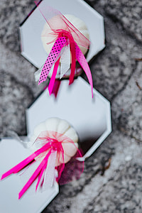 Decorative white pumpkin trinkets with ribbons on the floor