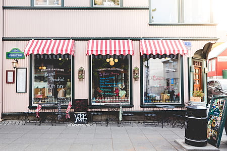 stores with red and white awning