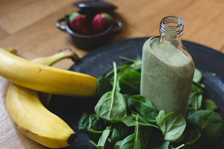 Homemade green smoothie with ingredients