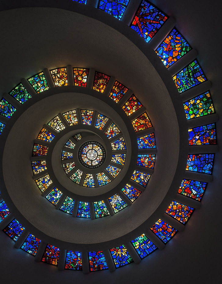bottom-view of spiral ceiling with stain glass windows