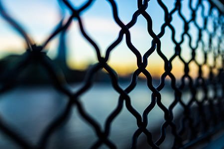 Close Photography and Tilt Lens of Black Chain Link Fence