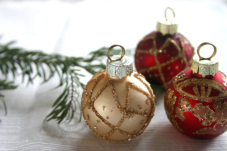 three Christmas baubles in tilt shift photography