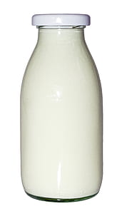 clear glass bottle with white liquid