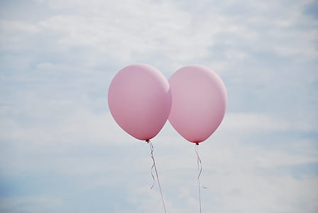 two pink balloons on focus photo
