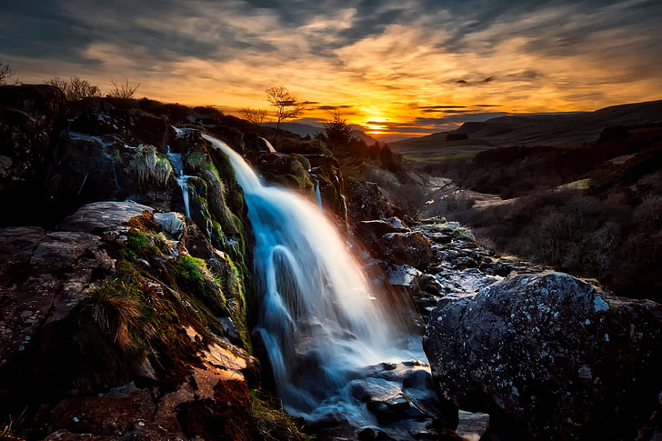 waterfalls under golden hour