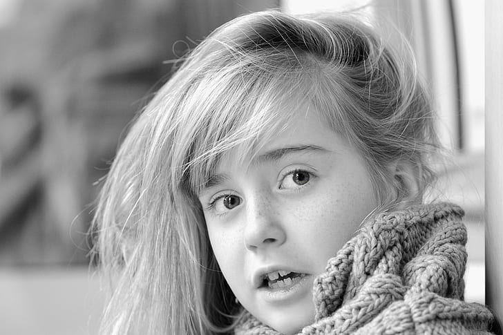 grayscale photo of girl wearing knitted apparel